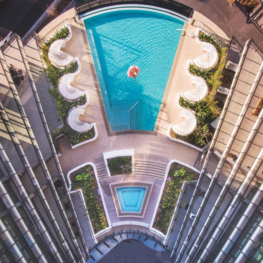 One Global Resorts Green Square Sydney Exterior foto The pool at the 1018